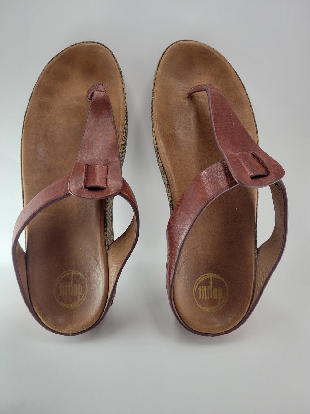FitFlop Women’s Brown Leather Thong Sandals with Buckle Accent
